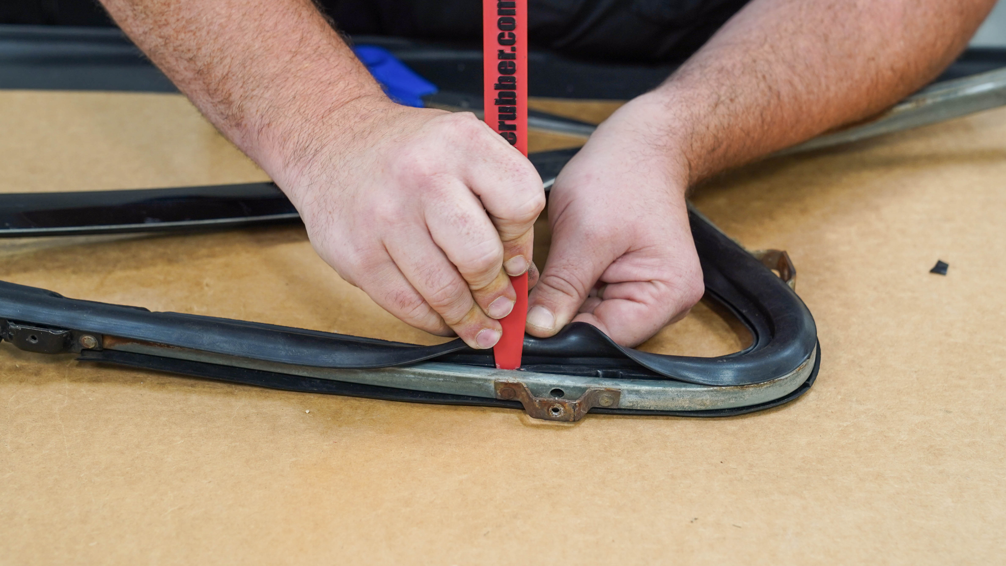 Pressing in new vent window weatherstripping