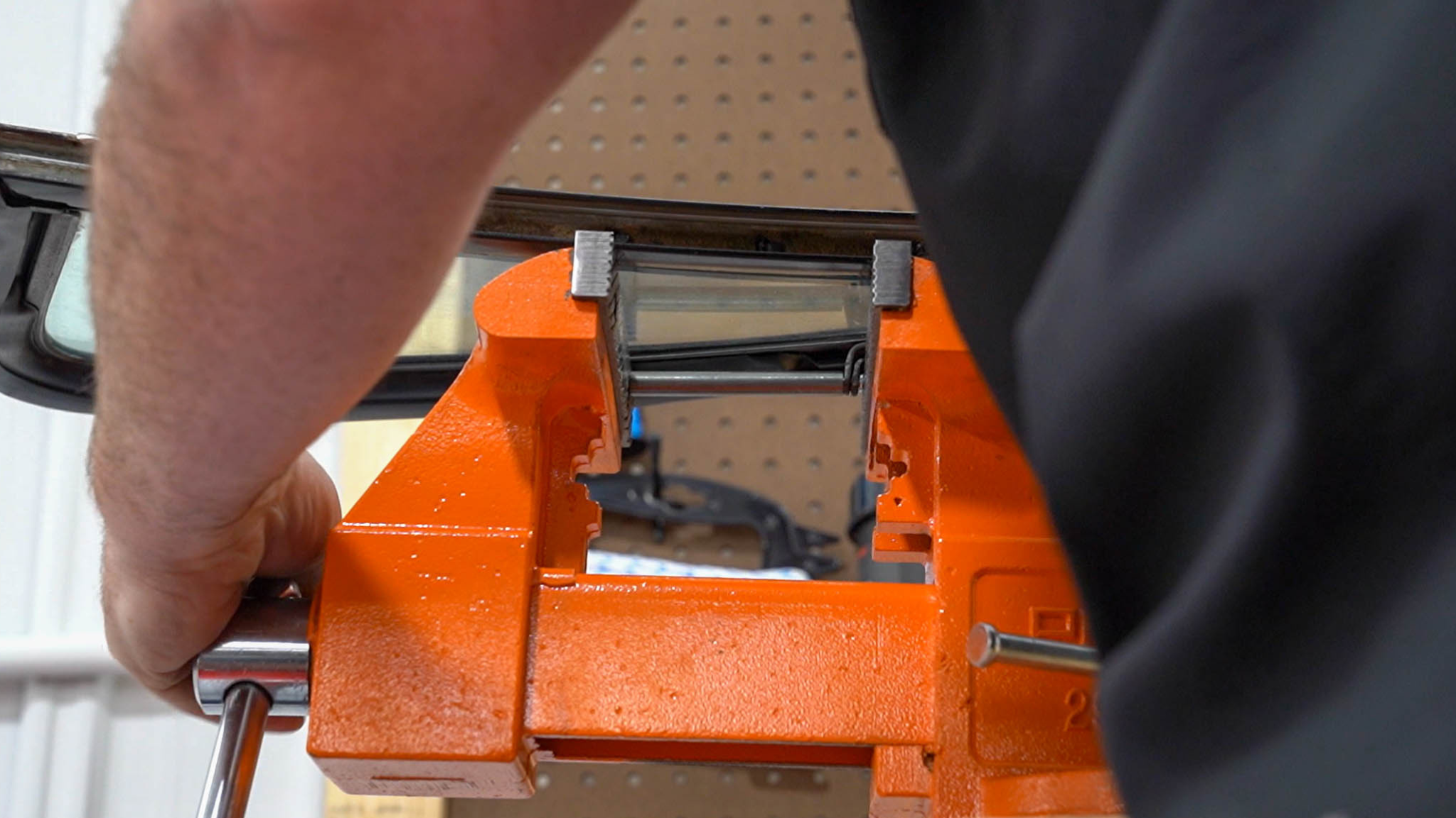 Setting pivot rivet with vise